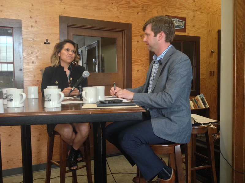 Antonia Gonzales, anchor and producer of “National Native News,” speaks with Matt Ehlman of the Numad Group in Rapid City, S.D. (Bart Pfankuch/Rapid City Journal)
